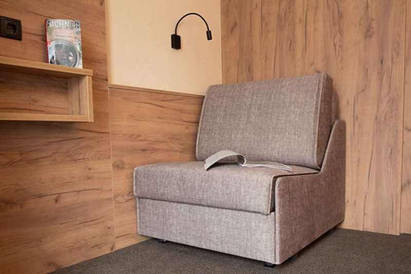 Comfortable armchair in apartment 102 in the Hotel Garni Sonnenheim